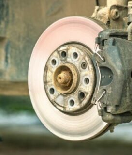 Closeup of braking disc of the vehicle with brake caliper for re
